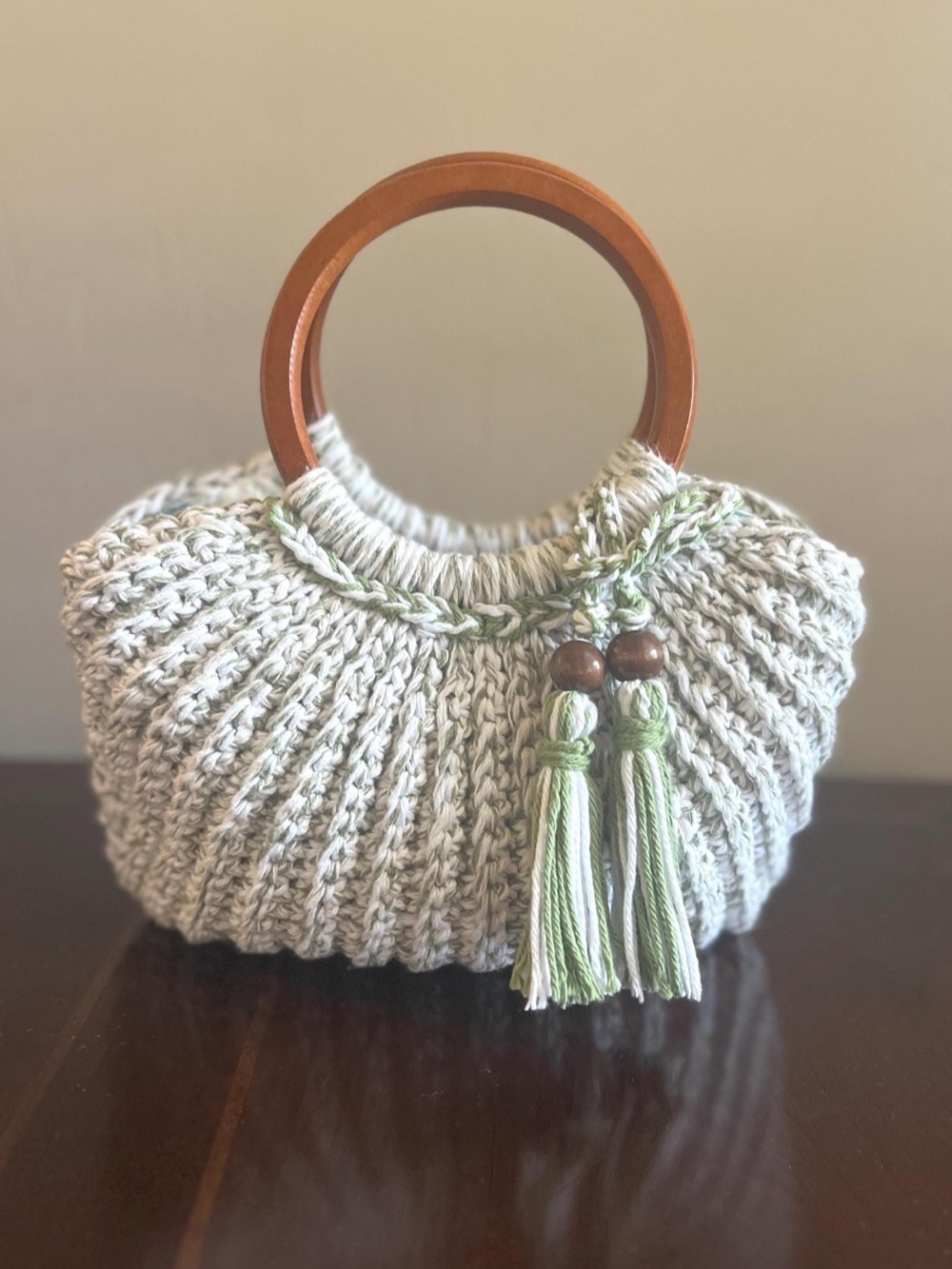 Handcrafted Cream Knit Tote with Wooden Handles and Green Tassels